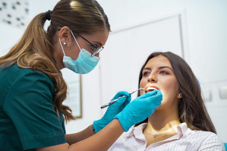 Closeup shot professional dentist with protective surgical mask