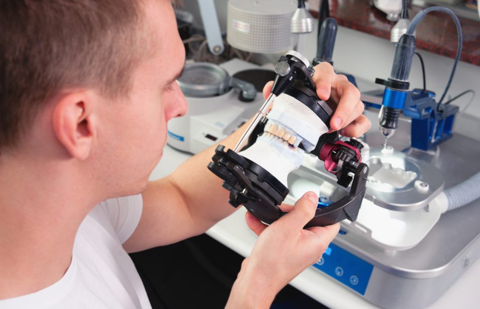 A man manufacturing ceramic crowns