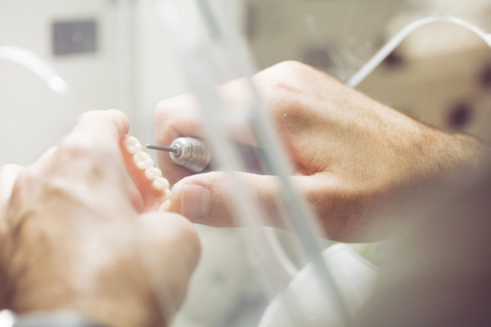 Polishing dentures in dental laboratory