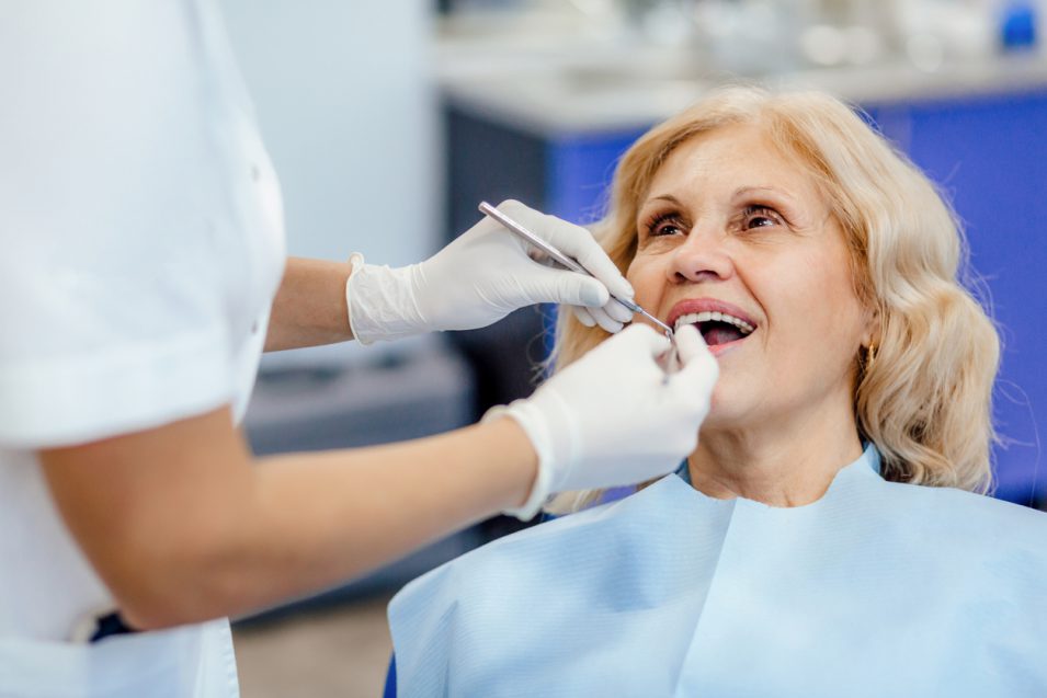 old lady getting root canal by hamilton dentist